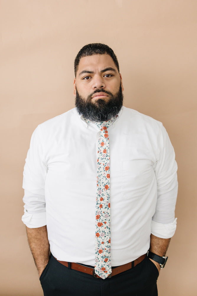 Citrus tie worn with a white shirt, brown belt and black pants.