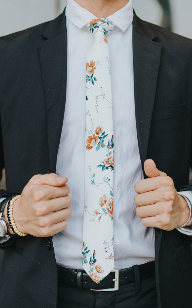 Copper Blooms tie worn with a white shirt and black suit.