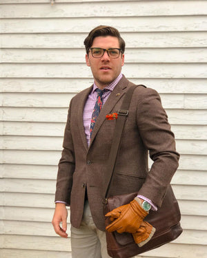 Coral Flor Tie on model wearing purple plaid shirt and brown suit jacket