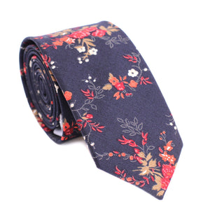 Coral Flor Skinny Tie. Navy background with Red, Orange, Gold, and White Flowers