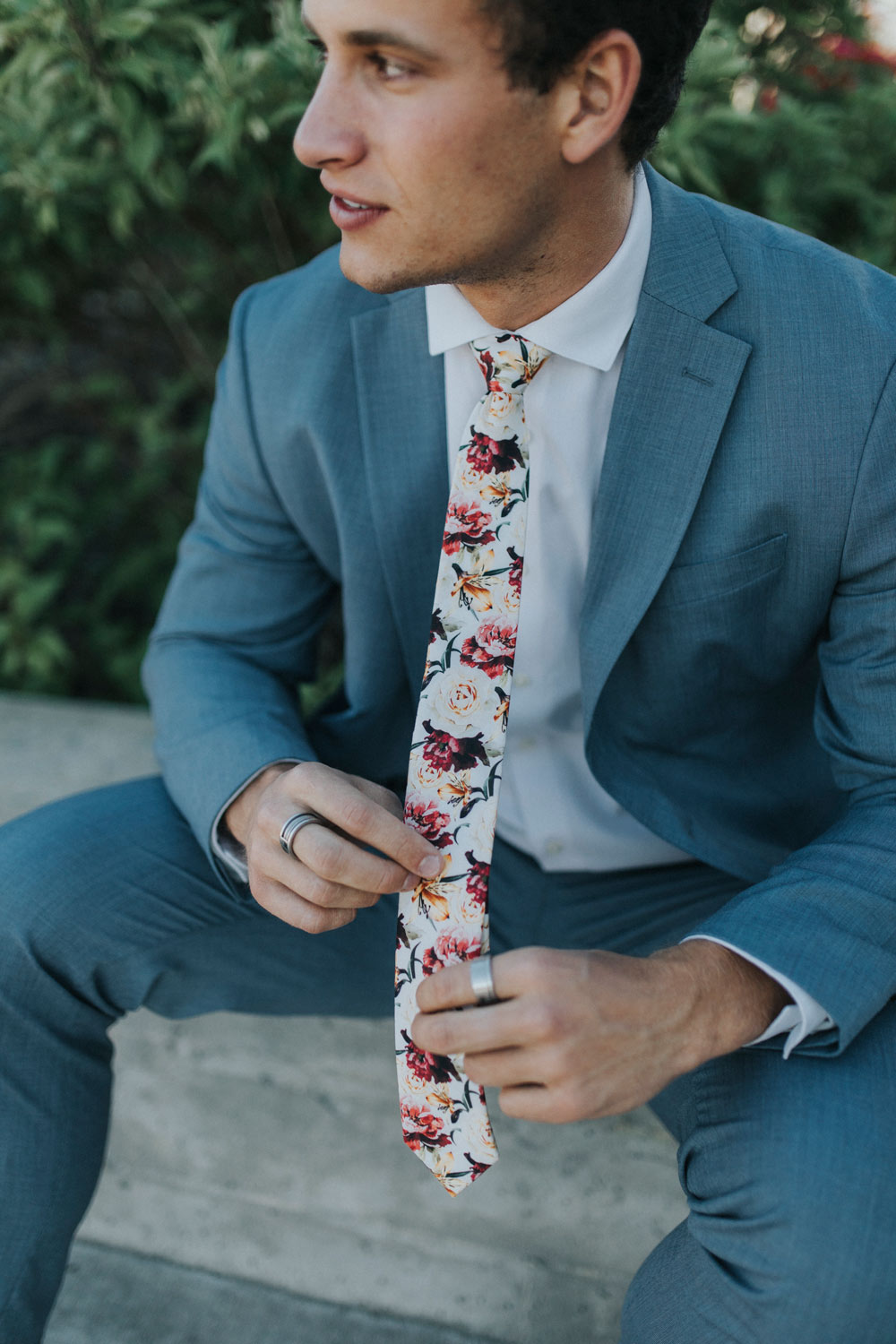 Coral Void tie worn with a white shirt and blue suit.
