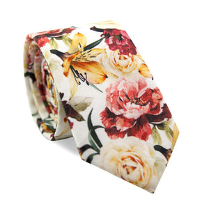 Coral Void Skinny Tie. White background with ivory, maroon and gold flowers and green stems and leaves. 