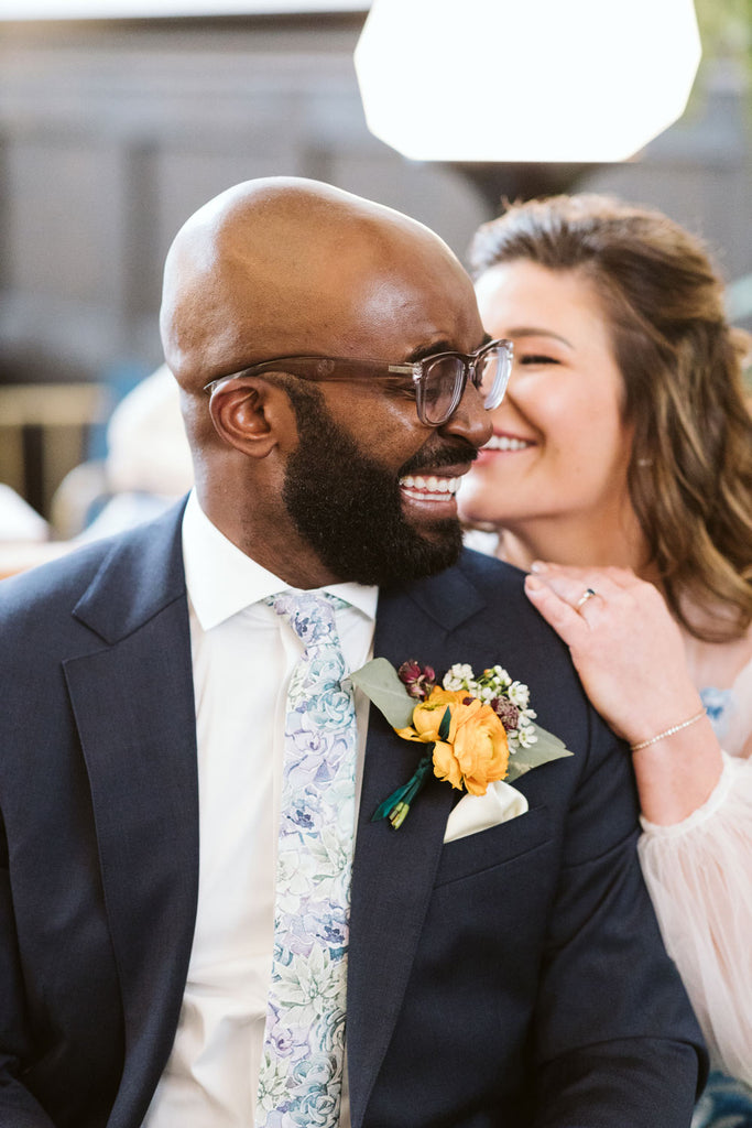 Crested Sunburst tie worn with a white shirt and blue suit jacket at a wedding.