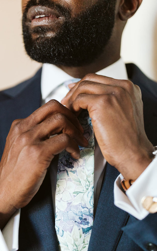 Crested Sunburst tie worn with a white shirt and blue suit jacket at a wedding.