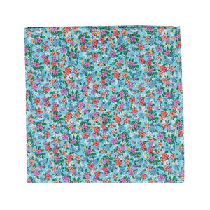 Dahlia Pocket Square. Light blue background with a variety of small pink, red, salmon and white flowers and green leaves. 