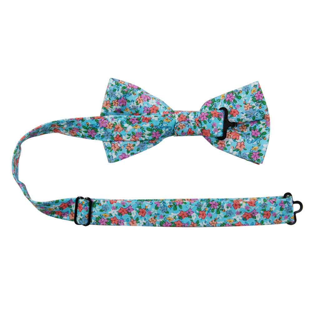 Dahlia Pre-Tied Bow Tie with adjustable neck strap. Light blue background with a variety of small pink, red, salmon and white flowers and green leaves. 