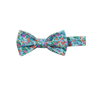 Dahlia Pre-Tied Bow Tie. Light blue background with a variety of small pink, red, salmon and white flowers and green leaves. 