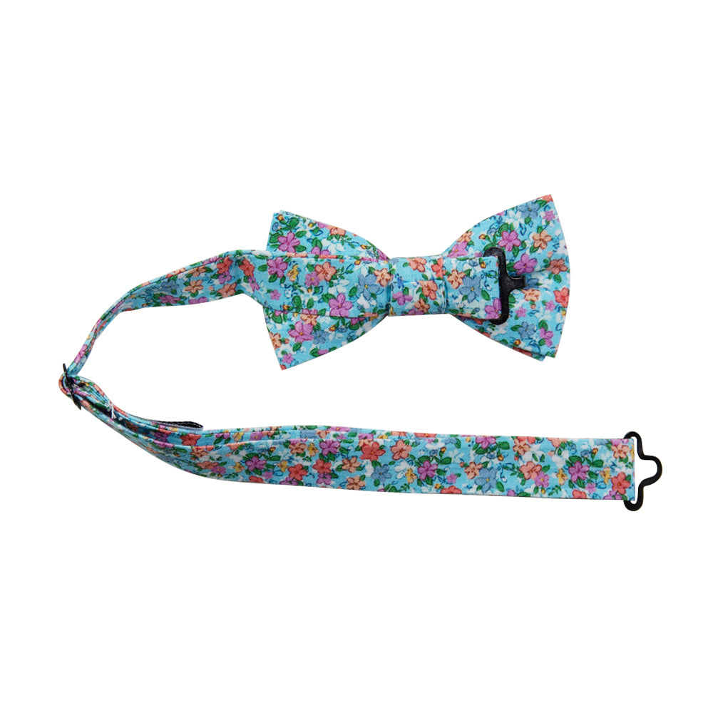 Dahlia Pre-Tied Bow Tie with adjustable neck strap. Light blue background with a variety of small pink, red, salmon and white flowers and green leaves. 