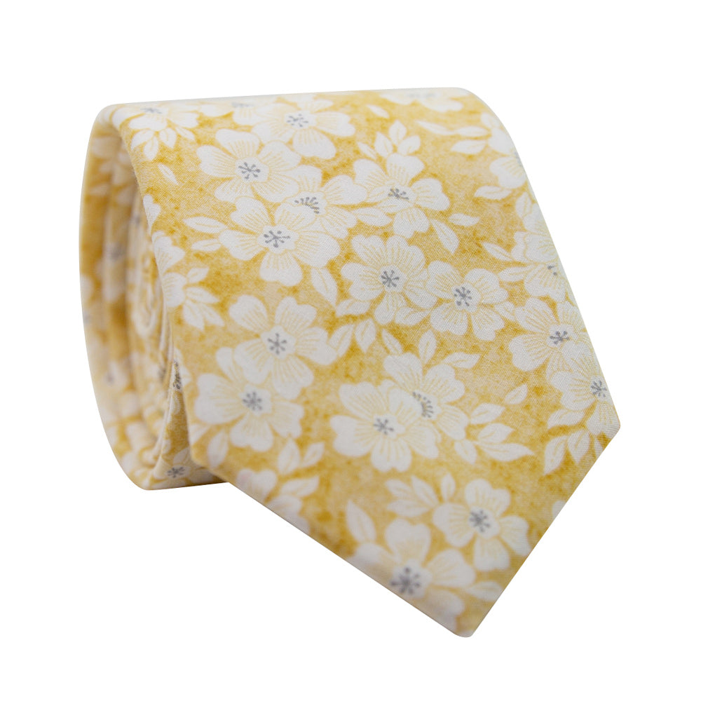 Daisy Skinny Tie. Yellow background with small white and yellow flowers throughout. 