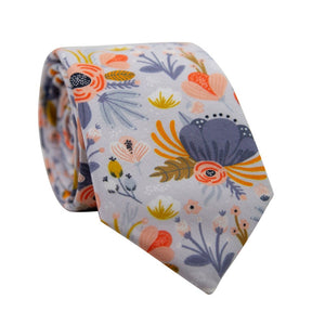 Desert Poppy Skinny Tie. Dusty blue background with painted flowers of various colors such as blue, orange, pink, peach and gold.