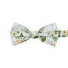 Desert Sun Pre-Tied Bow Tie. White background with round yellow flowers, green and silver leaves. 