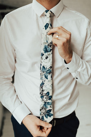Dreamy Fields tie worn with a white shirt and black pants. 