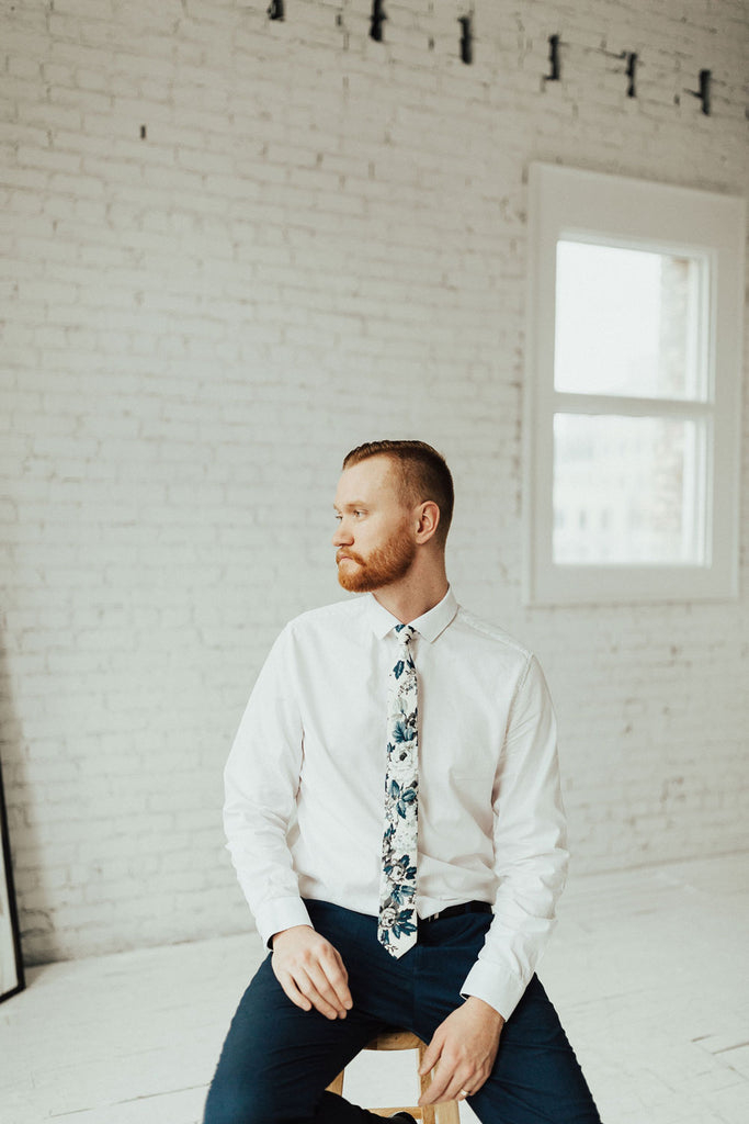 Dreamy Fields tie worn with a white shirt and black pants. 