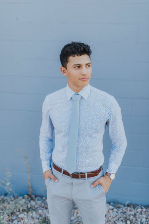 Splash of Color: Styling Ties with Light Blue Dress Shirts and Grey Su