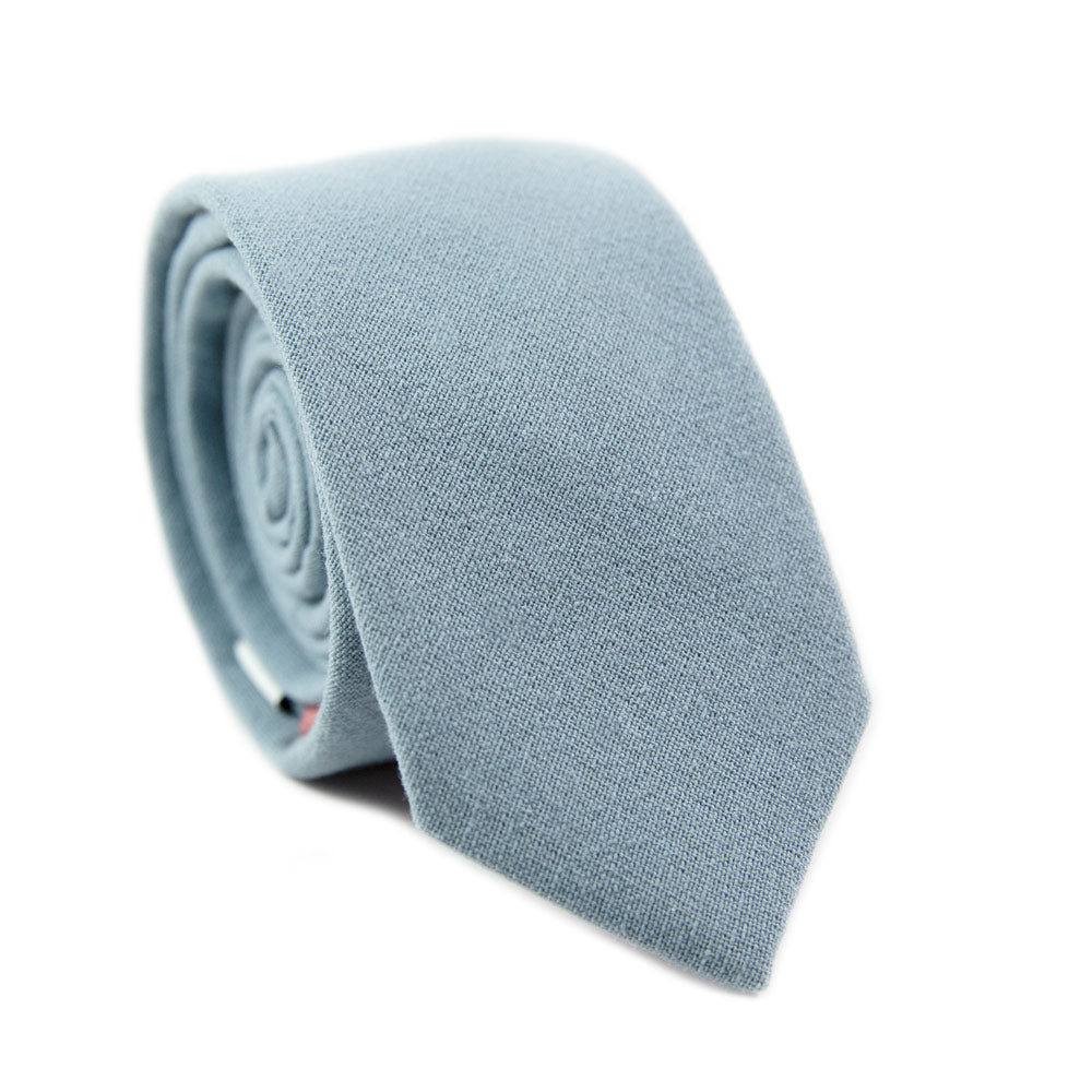 Dusty Skinny Tie. Solid light blue textured fabric.