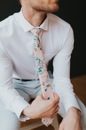 Dusty Lily tie worn with a white shirt, brown belt and gray pants.