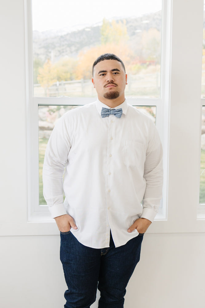 East Coast pre-tied bow tie worn with a white shirt and blue jeans.