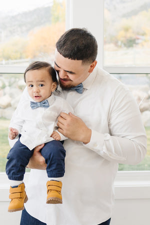 East Coast pre-tied bow tie worn by a father and son with a white shirt and blue jeans.