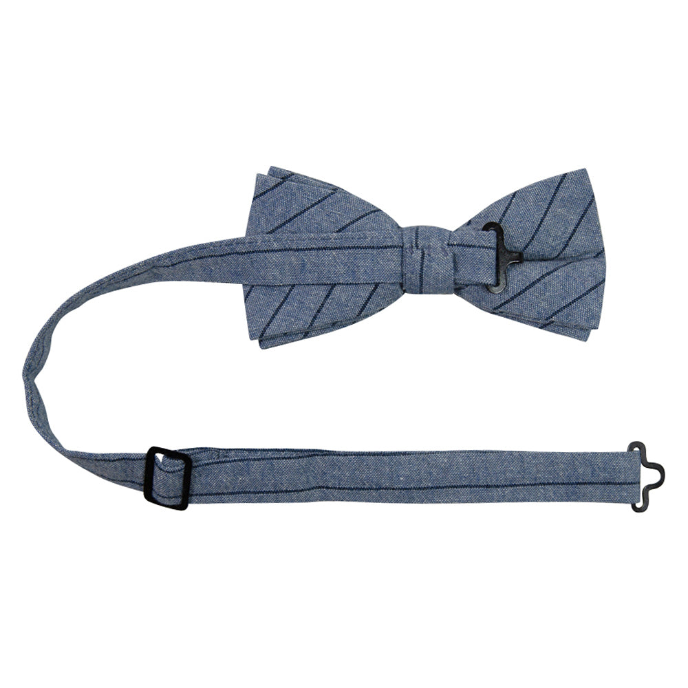 East Coast Stripe Pre-Tied Bow Tie with adjustable neck strap. Dusty blue textured background with thin navy diagonal stripes.