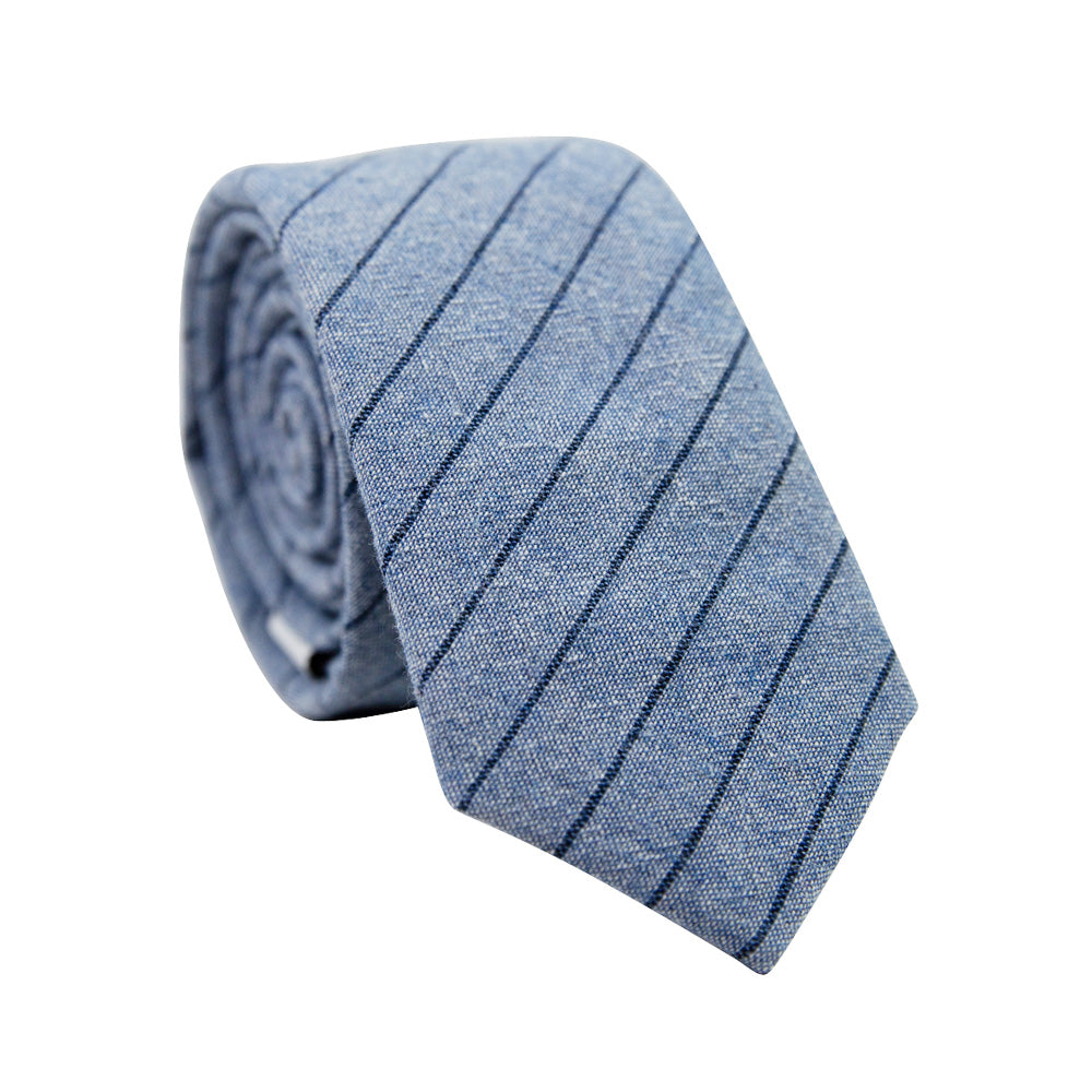 East Coast Stripe Skinny Tie. Dusty blue textured background with thin navy diagonal stripes.