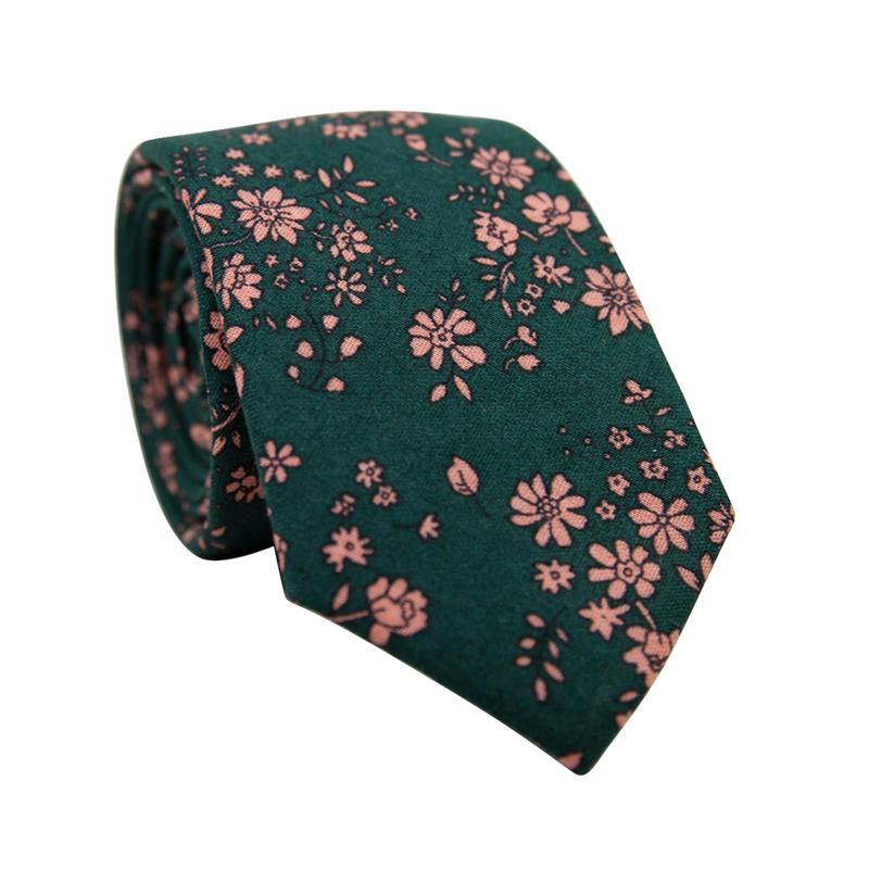 Evergreen Floral Skinny Tie. Green background with small blush pink flowers throughout.