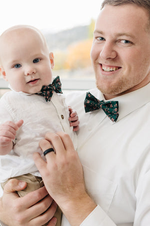 Evergreen pre-tied bow tie worn by a father and son with a white shirt and tan pants.