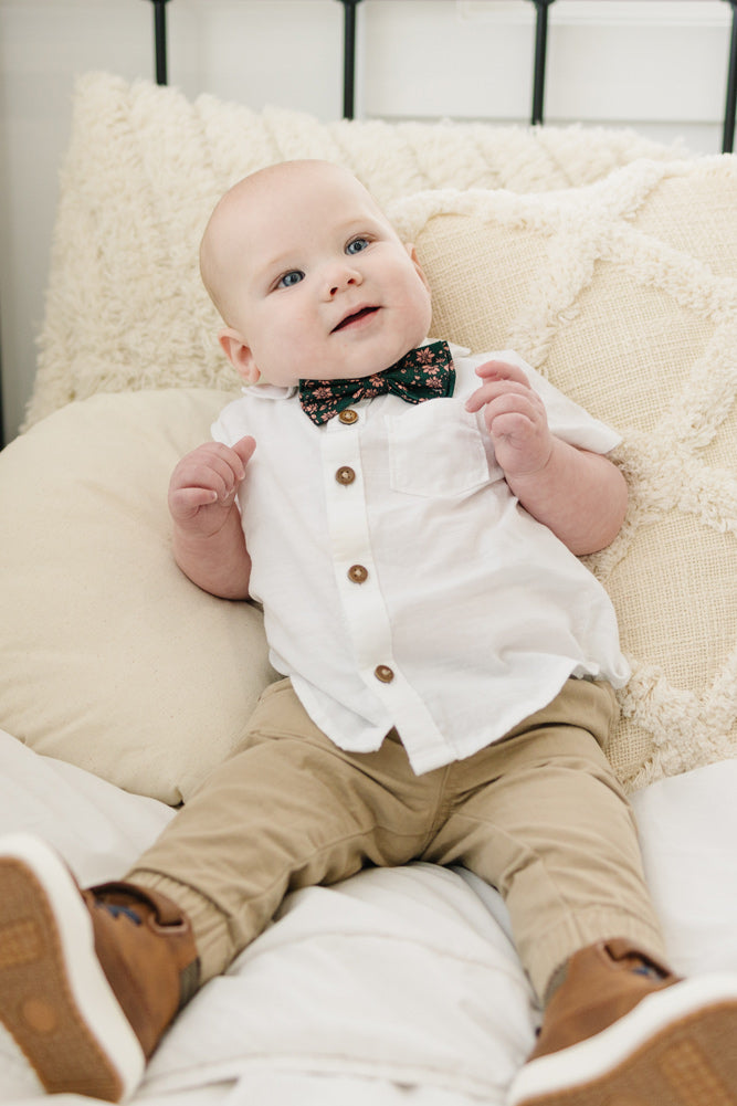 Evergreen pre-tied bow tie worn with a white shirt and tan pants, brown boots.