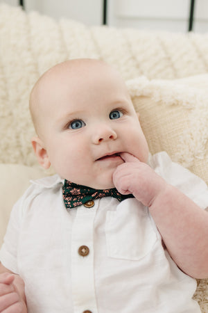 Evergreen pre-tied bow tie worn with a white shirt.