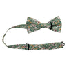 Faded Jade Pre-Tied Bow Tie with adjustable neck strap. Sage background with white, blush and yellow flowers with blue flower centers, dark sage leaves.