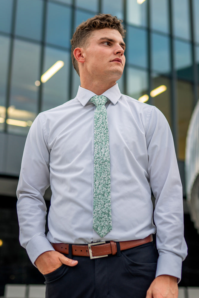 Feelin Lucky tie worn with a white shirt and navy blue pants.