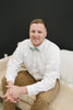 Feelin Lucky pre-tied bow tie worn with a white shirt and tan pants.