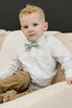 Feelin Lucky pre-tied bow tie worn with a white shirt and tan pants.