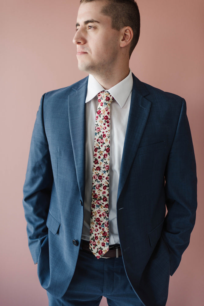 Fiore tie worn with a white shirt and blue suit. 