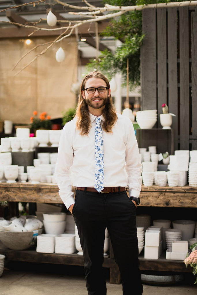French Garden tie worn with white shirt and black pants.