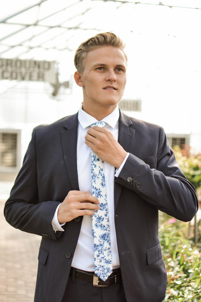 French Garden tie worn with white shirt and navy suit.