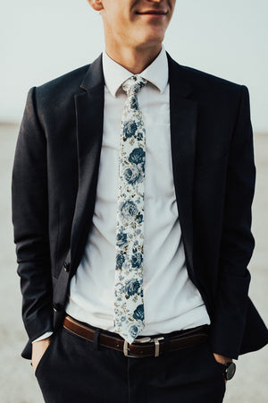 Frisco tie worn with white shirt and dark navy suit.