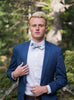 Frisco Bow Tie worn with a white shirt, brown belt and royal blue suit.