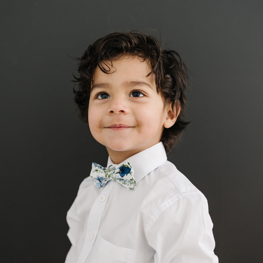 Frisco pre-tied bow tie on a young boy wearing a white shirt.