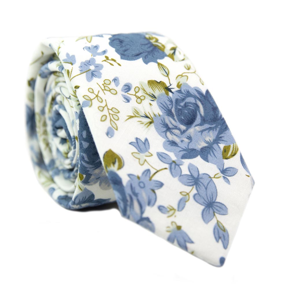 Frisco Skinny Tie. White background with small and medium size light blue flowers and sage green leaves.