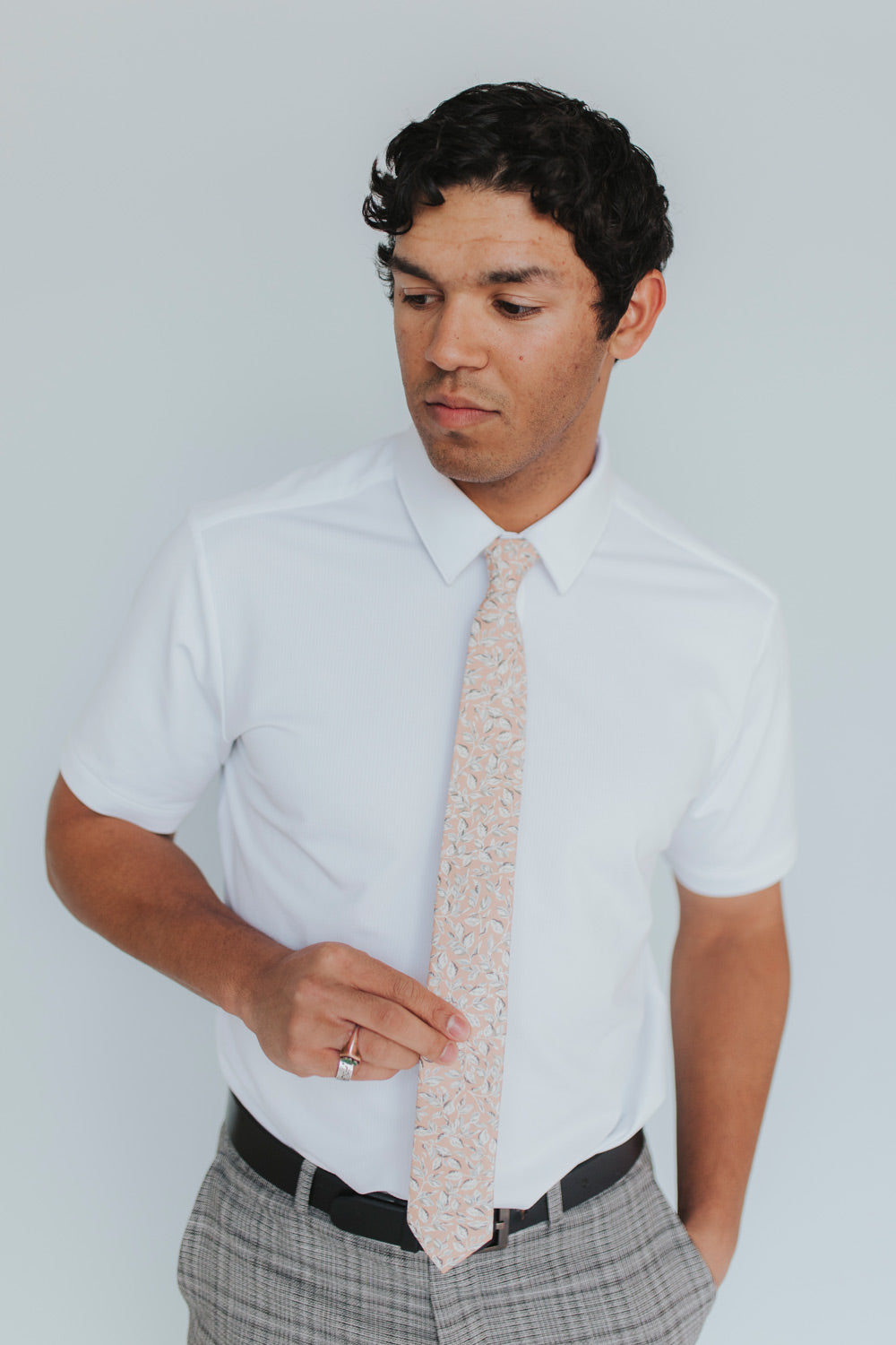 Georgia Belle Tie worn with a white shirt, black belt and gray plaid suit pants. 