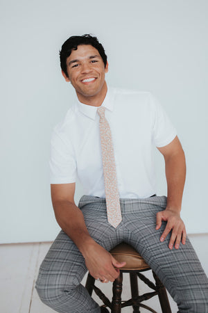 Georgia Belle Tie worn with a white shirt, black belt and gray plaid suit pants. 