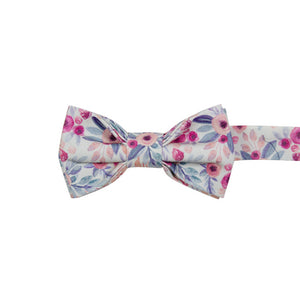 Hermosa Pre-Tied Bow Tie. Cream/off white background with pink and peach circular flowers and blue and green leaves throughout.