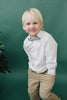 Hidden Garden pre-tied bow tie worn with a long sleeve white shirt and tan pants. 