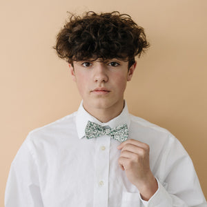 Hidden Garden pre-tied bow tie worn with a long sleeve white shirt.