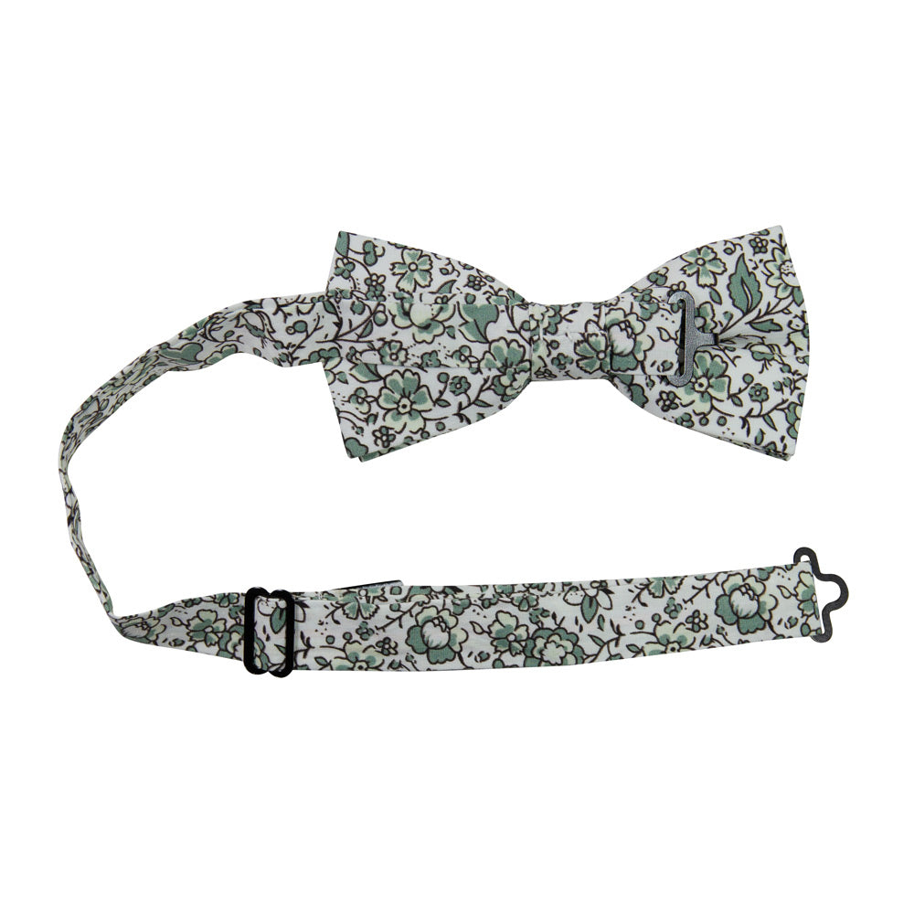 Hidden Garden Pre-Tied Bow Tie with adjustable neck strap. White background with sage green flowers and leaves with black vines.