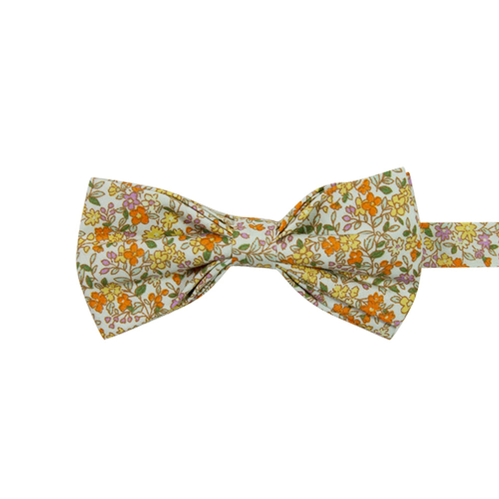 Honey Pre-Tied Bow Tie. Off white background with small yellow, orange, and pink flowers throughout. 