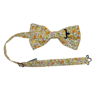 Honey Pre-Tied Bow Tie with adjustable neck strap. Off white background with small yellow, orange, and pink flowers throughout. 