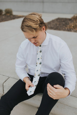 Honeysuckle tie worn with a white shirt, brown belt and black pants.