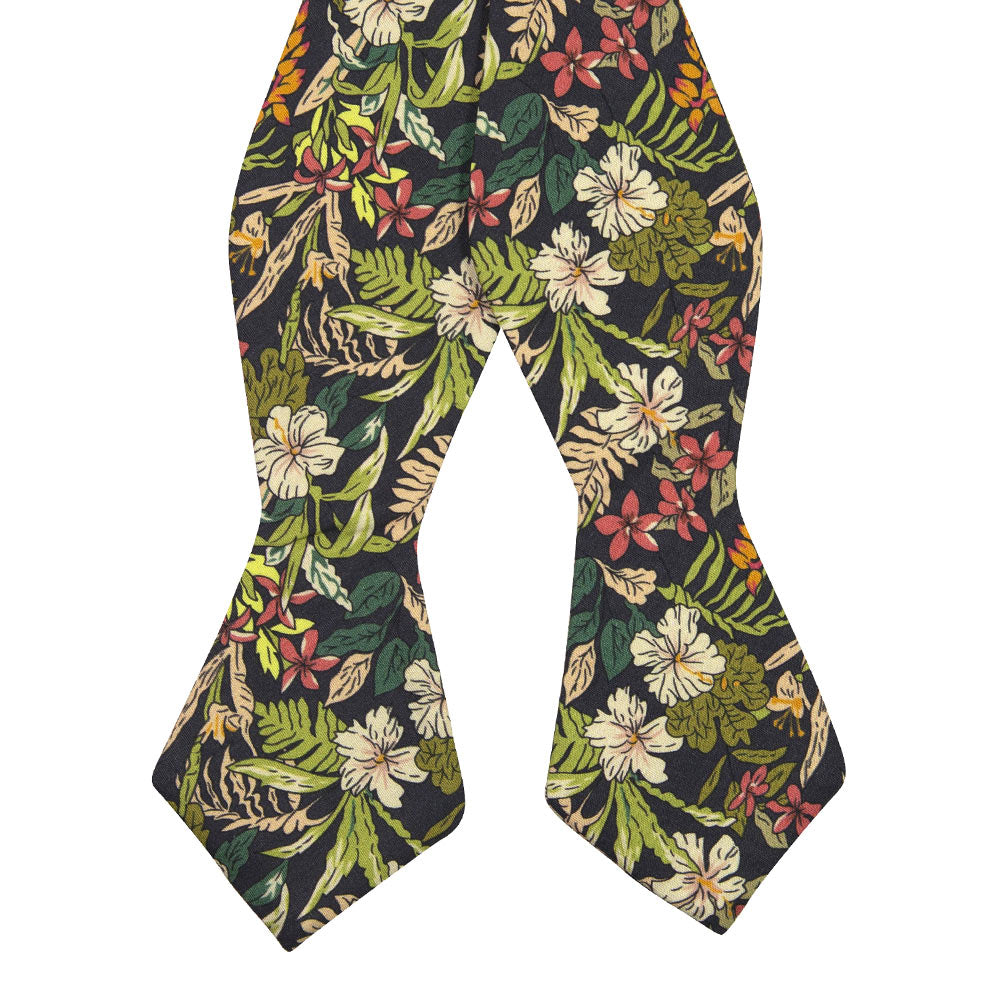 Jumanji Self Tie Bow Tie. Grayish background with white, green, red, orange and yellow jungle leaves over the entire tie.