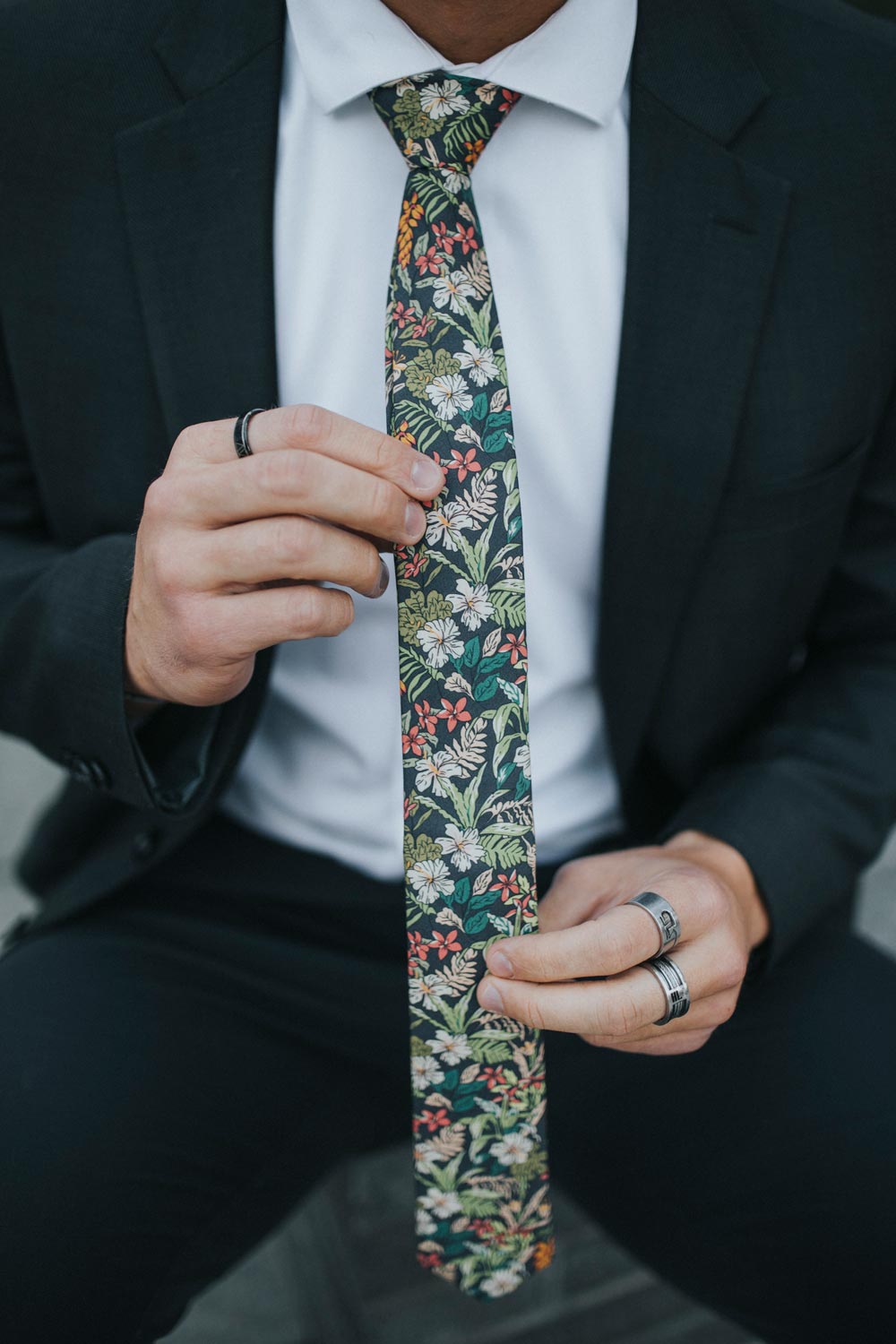 Jumanji tie worn with a white shirt and dark gray suit.